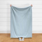 thin vertical blue and yellow stripes on textured light blue | large