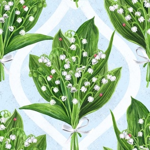Bouquet of lilly of the valley flowers on soft blue