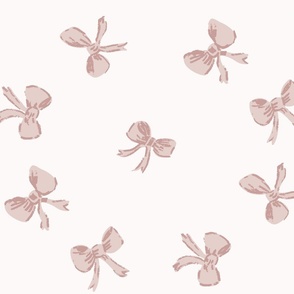 large scale tossed preppy bows in dusky pink