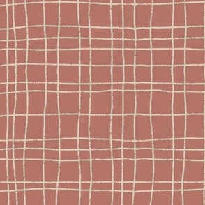 Wavy grid of tan stripes on rust background.