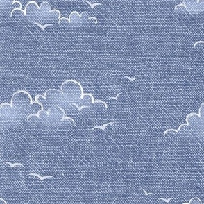 Chambray Cotton Clouds with Seagulls in Stonewash Blue | Summer sky, hand drawn clouds and birds on natural cotton, chambray pattern, warp and weft weave pattern, seaside sky on stonewash denim blue, ocean decor.