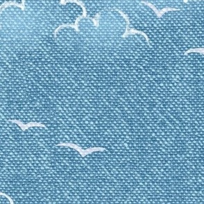 Chambray Cotton Clouds with Seagulls in Bahama Blue (xl scale) | Summer sky, hand drawn clouds and birds on natural cotton, chambray pattern, warp and weft weave pattern, tropical sky in Caribbean blue, ocean decor.