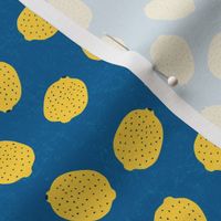 Ditsy yellow lemons on blue background