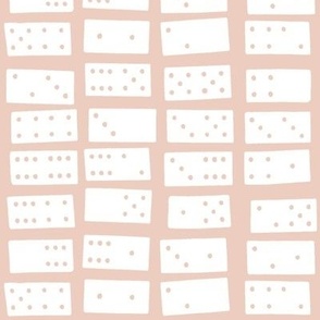 dominoes on pale pink