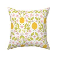 Fresh Yellow Lemons and Pink Flowers with Green Leaves on White Background