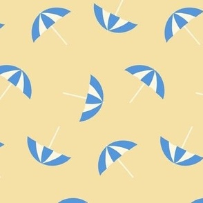 Scattered umbrellas on the beach in blue