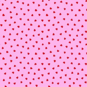 Tiny red hearts on pink