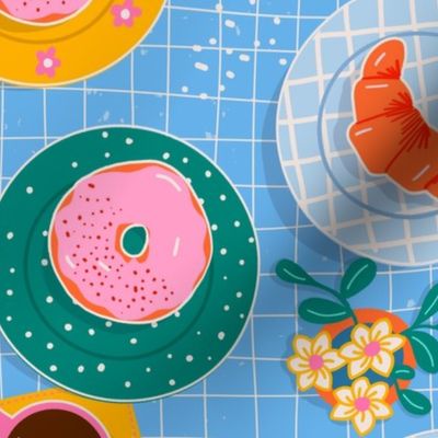 Happy Breakfast Sweet Treats - pastries on bright patterned plates