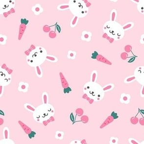Funny rabbits with cherry, carrot and flower