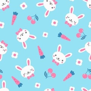 Funny rabbits with cherry, carrot and flower
