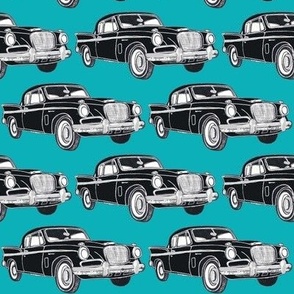 Black Studebaker Hawk on turquoise background