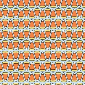 Small Geometric Cartoon Candy Corn in Soft Blue, Orange, and Yellow for Halloween