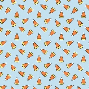 Small Tossed Cartoon Candy Corn in Soft Blue, Orange, and Yellow for Halloween