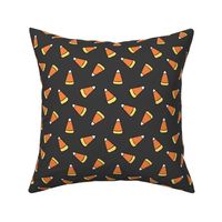 Medium Tossed Cartoon Candy Corn in Dark Gray, Orange, and Yellow for Halloween