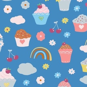 cupcakes charries and rainbows on blue -medium scale