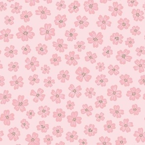 Pink flowers scattered on solid pink background