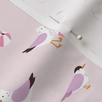 Seagulls and terns playing with beach balls - beige, purple and pink - small scale