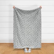 Small Block Printed Field of Polka Dots in ecru off white on light warm grey