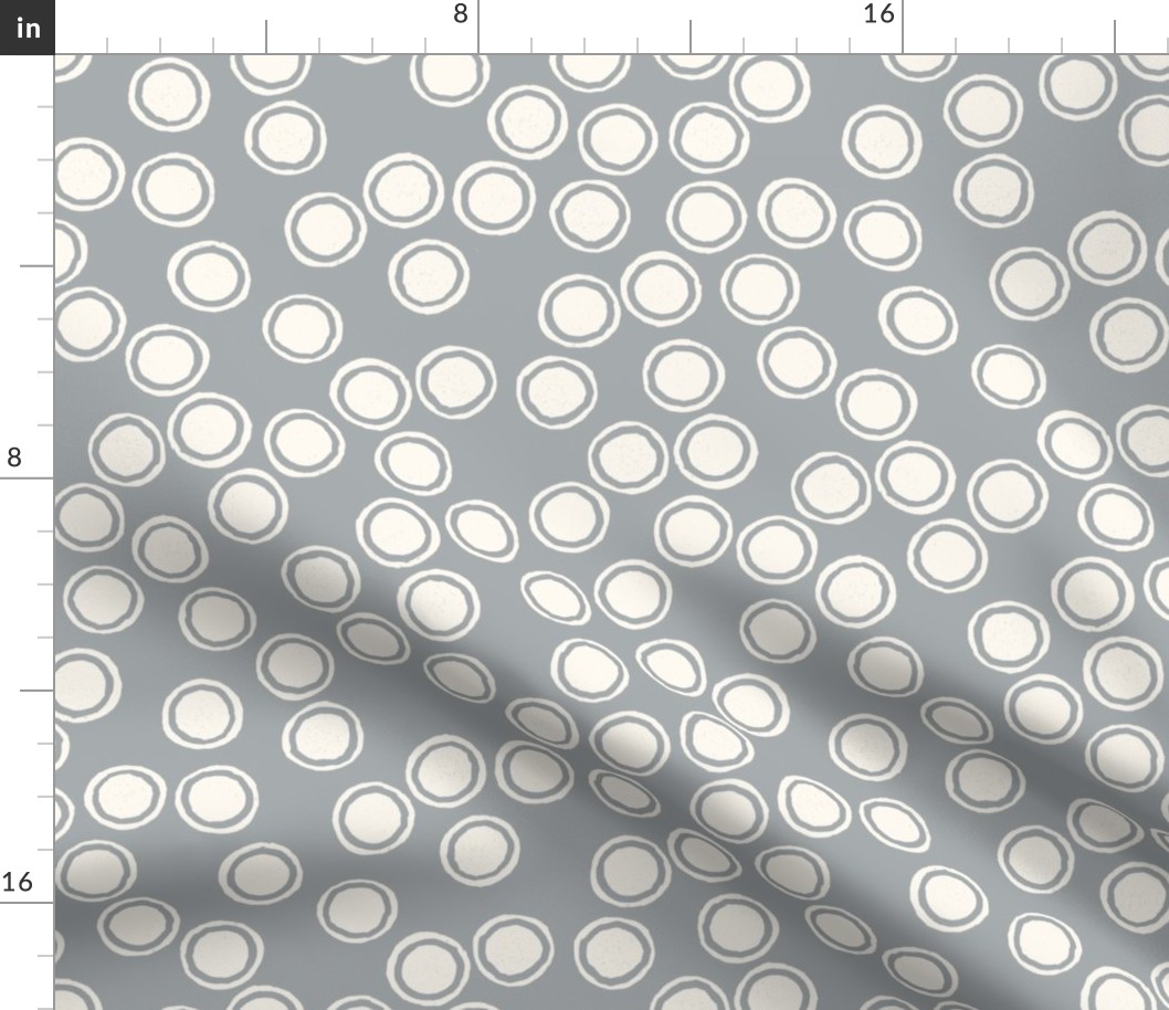 Small Block Printed Field of Polka Dots in ecru off white on light warm grey