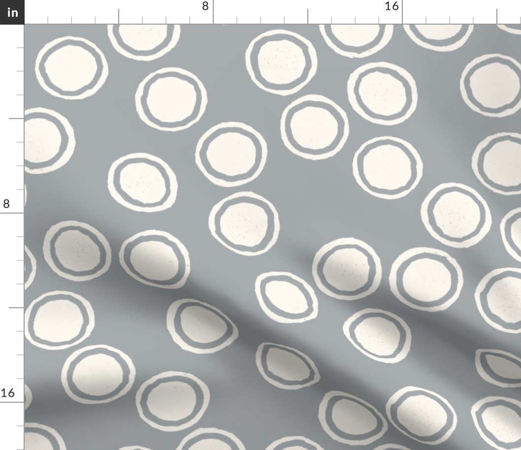 Large Block Printed Field of Polka Dots in ecru off white on light cool grey