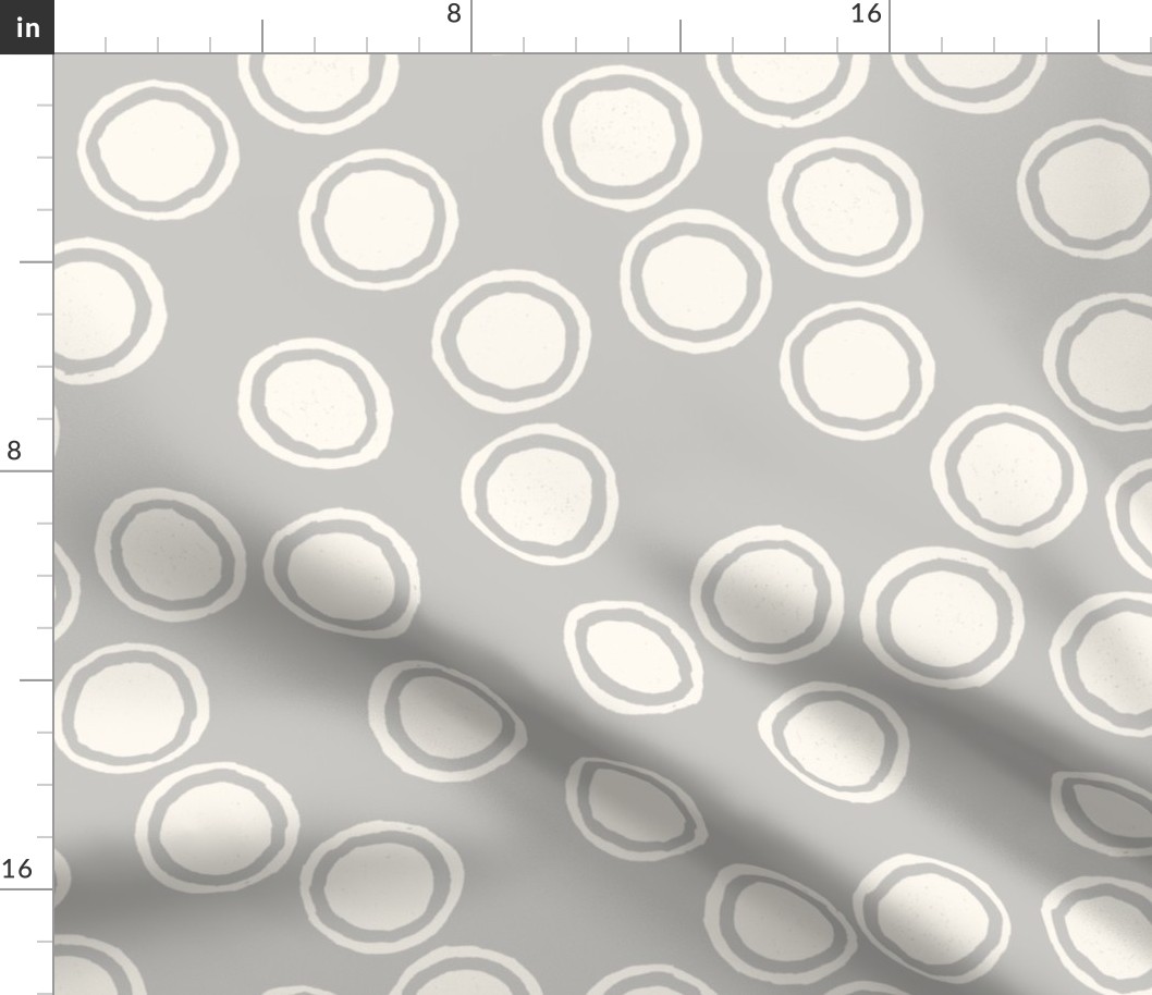 Large Block Printed Field of Polka Dots in ecru off white on light warm grey