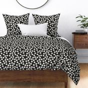 Small Block Printed Field of Polka Dots in ecru off white on soft black