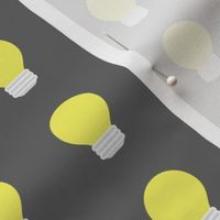 Yellow Light Bulbs on Gray Background