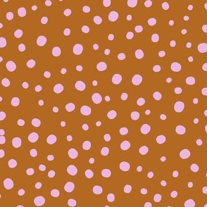 L|Geometric irregular pink speckled polka dots on red brown