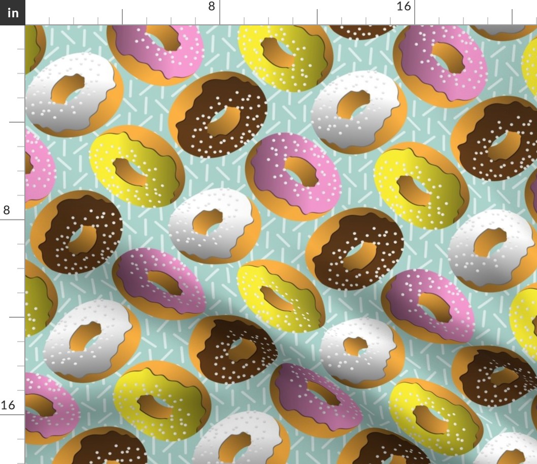 Assorted Glazed Donuts on Light Teal With Sprinkles