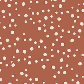 Light Sand Beige Dots Hand-drawn and Scattered on a Warm Red Clay Background