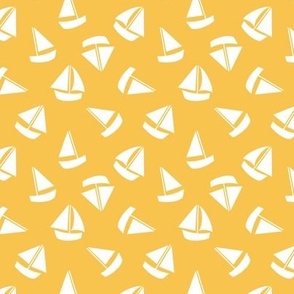White Sailboats tossed on yellow