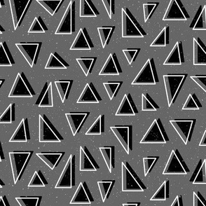 Neutral Geometric Triangle Shapes in Black on a Grey Background 