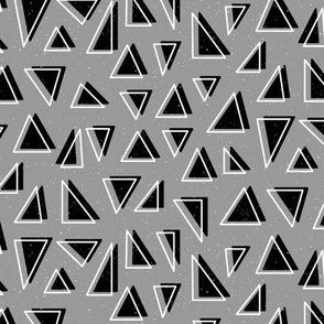 Neutral Geometric Triangle Shapes in Black on a Light Grey Background 