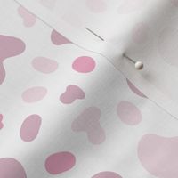 Vector hand drawn pink coloured spots composition on white background.