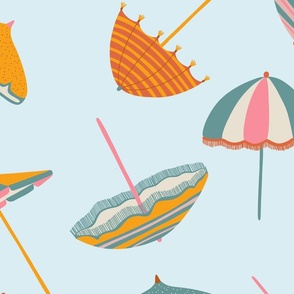 Tossed Beach Umbrellas in different shapes and colours – colourful parasols on a light blue background in a large scale