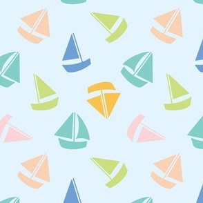 Colourful summer sailboats on light blue 