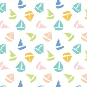 Small Colourful summer sailboats on white