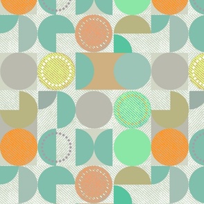 Geometric grey, green, orange pattern on a light background.