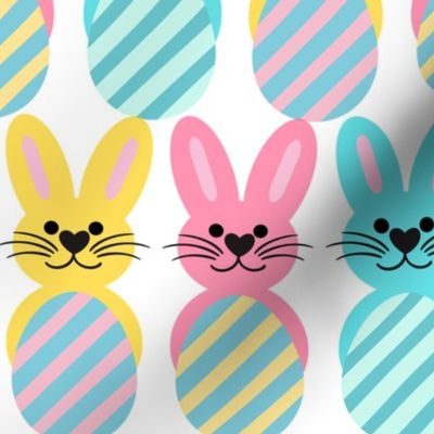 Cute bunnies with striped Easter eggs