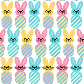 Cute bunnies with striped Easter eggs