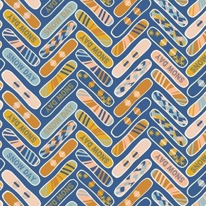 Colorful Snowboards in herringbone style in blue, peach and yellow