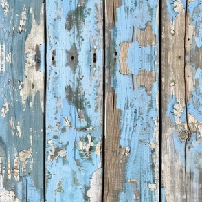 Old vertical wooden boards with old chipping blue paint peeling off. Old Painted Wooden Planks Photorealistic Seamless Pattern. Blue Wooden Planks Wallpaper.