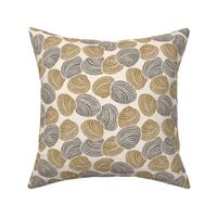 Seashells (M) in honey yellow and brown with sand texture - tossed design on beige background 