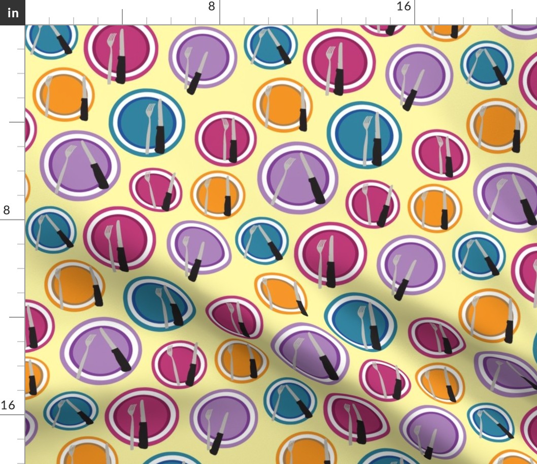 Purple, orange, blue, and pink plates composition with cutlery on an light yellow background