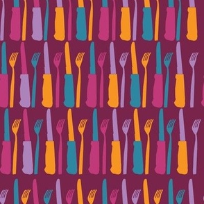 Bold and bright coloured cutlery in a horizontal pattern formation on a dark purple background