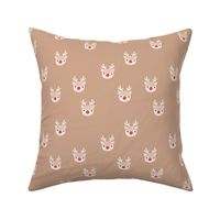 Little kawaii Christmas Rudolph reindeer with antlers and red nose on beige