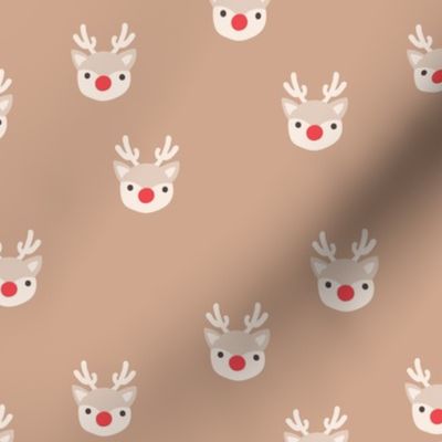 Little kawaii Christmas Rudolph reindeer with antlers and red nose on beige