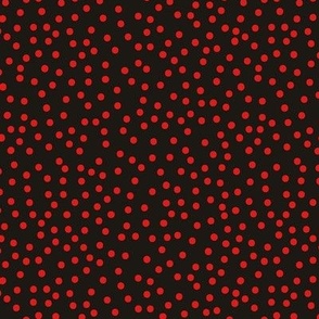 Red dots tossed on soft black