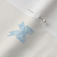 Small Two Directional Pastel Blue Bow Ribbons on Benjamin Moore White Opulence Background