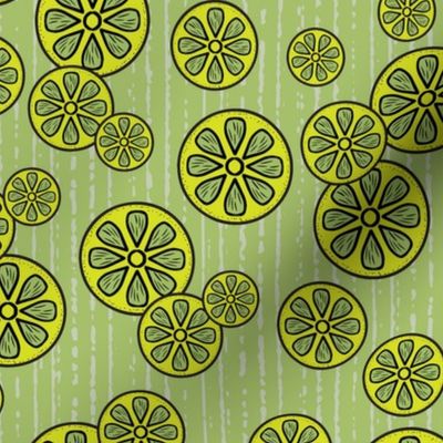 Festive Lime Slices Tossed in Green and Yellow on a Textured Green Background